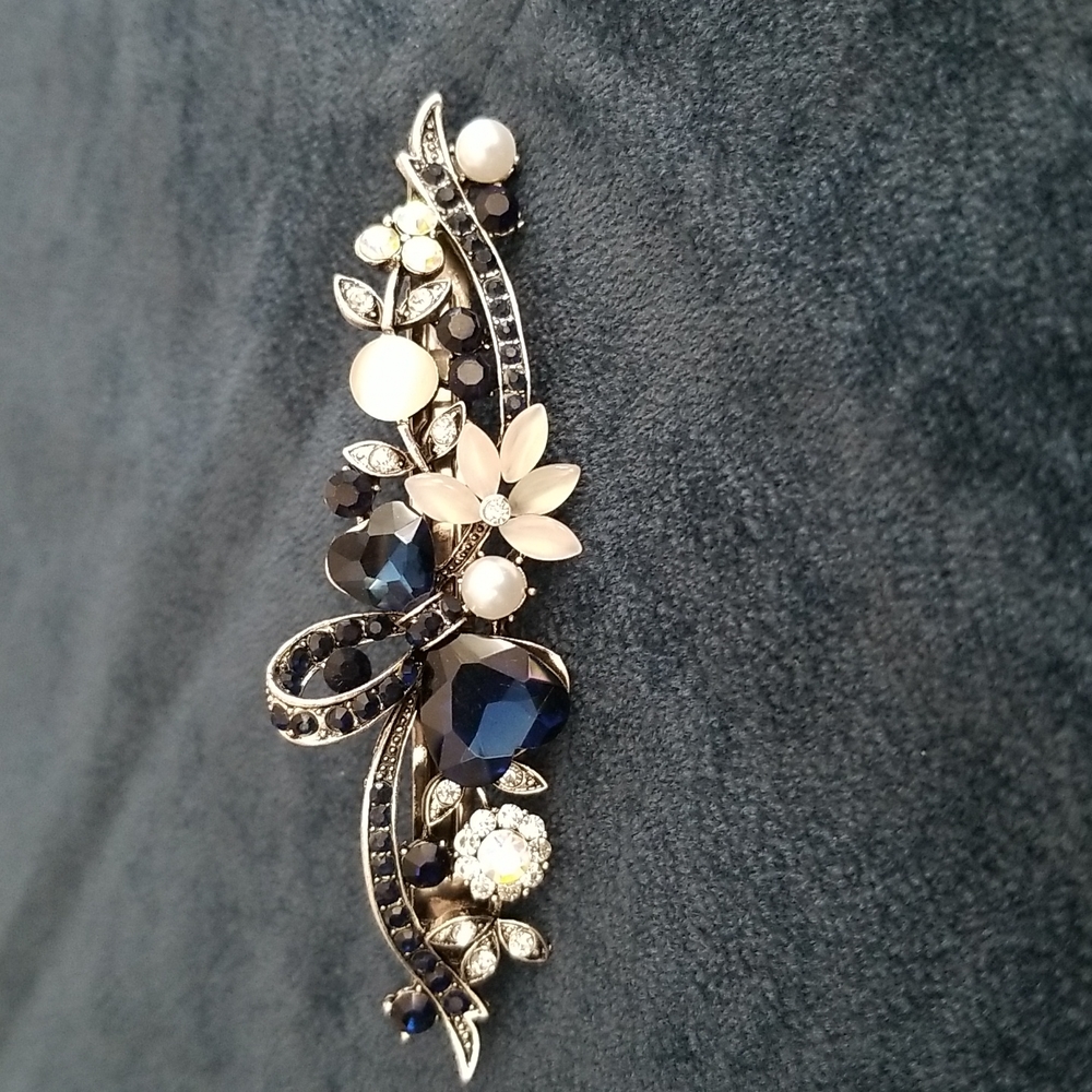 Hair accessory.  Silver metal with blue stones and multi colored crystals .